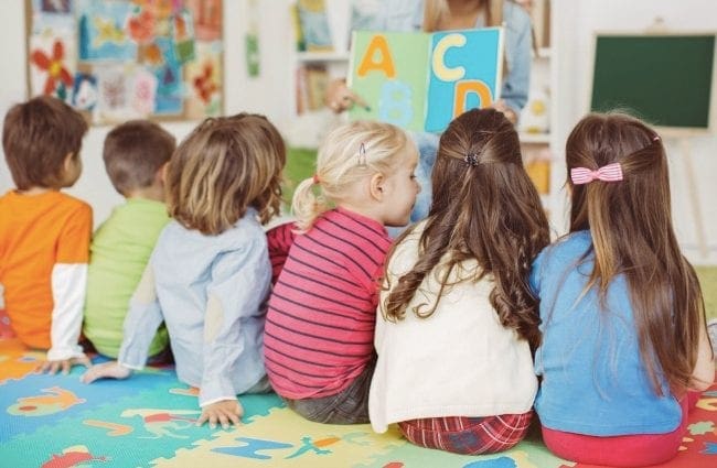Kids on a classroom. Education Assistants can work in elementary and secondary schools.