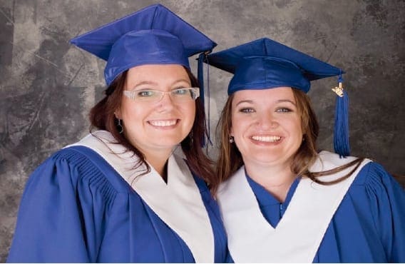 Elisha and Kari-Lynn wearing their graduation gown. They've finished the Psychiatric Nursing Program together!