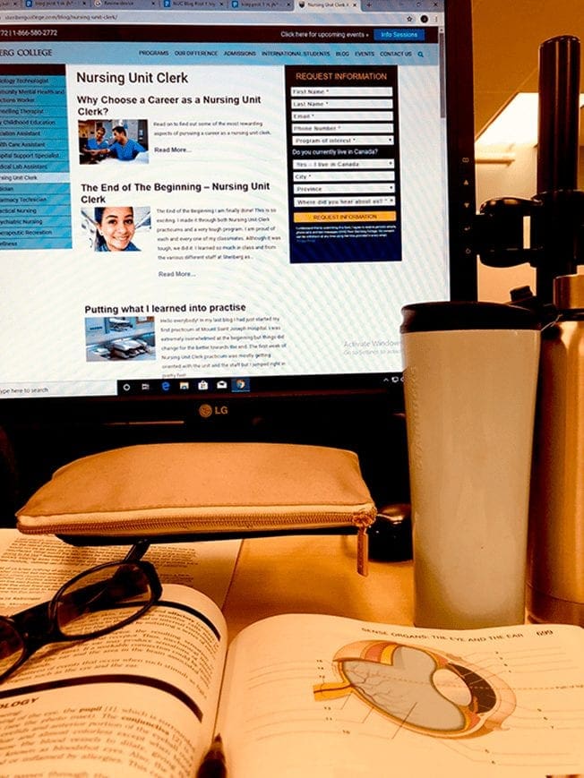 Computer, coffee, books and, of course, reading glasses are Joy's tools on preparing to be a Unit Clerk.
