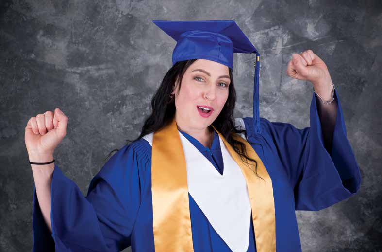 Tara Wall smiles in grad gown. She followed her passion and is now a Community Worker.