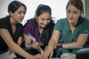 Munika, Nelofar and Tia studying in the licensed practical nurse diploma program at Stenberg College.