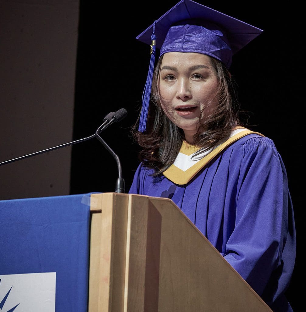 Carmen Deng accepting the Christopher Wittig Award at Stenberg's Spring 2022 graduation ceremony.