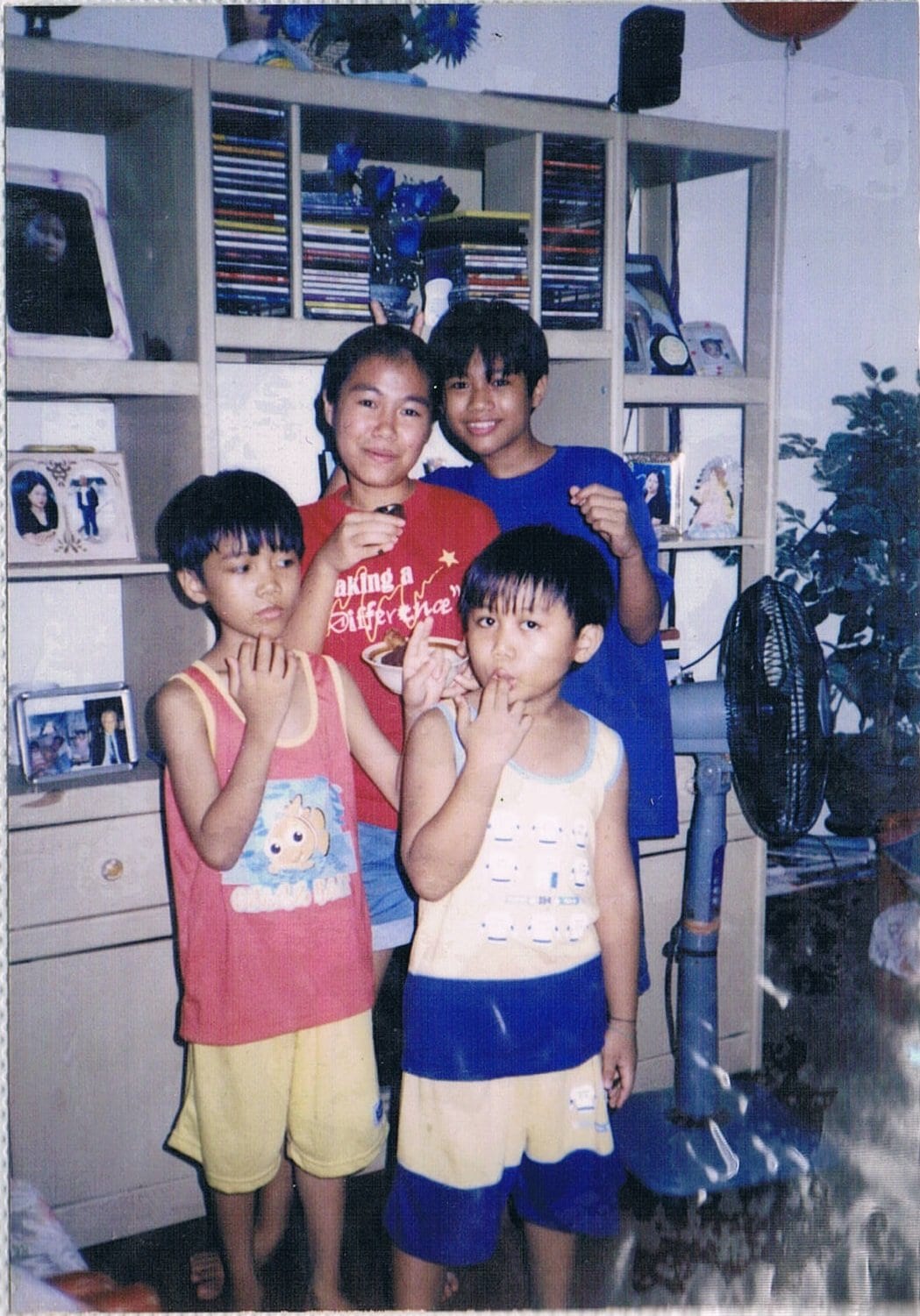 Faith having fun with her younger siblings in their home in the Philippines.